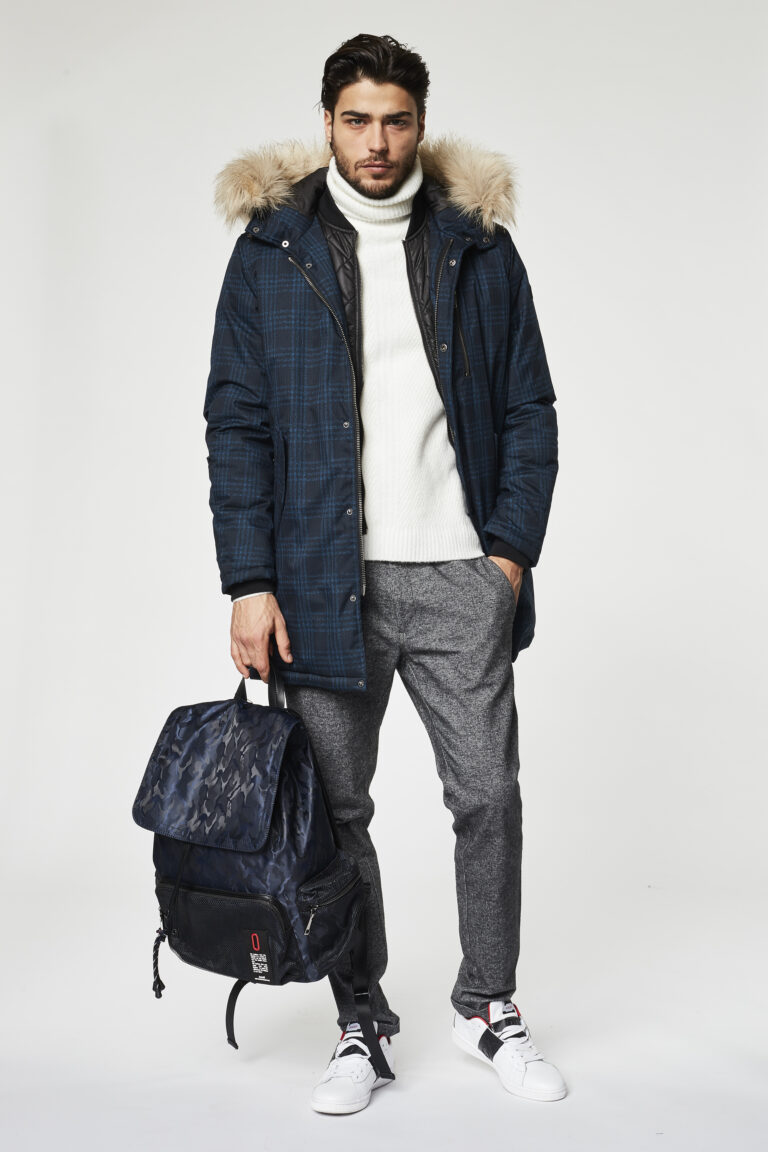 Gaudì Menswear FW20 lookbook: navy check fur-trimmed hooded parka over white turtleneck with camouflage backpack – Leonardo Del Paggio, menswear designer